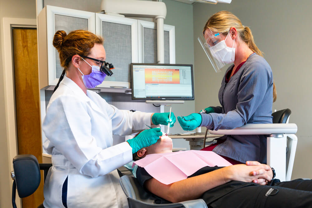 Dr Evan Garrison working on patient